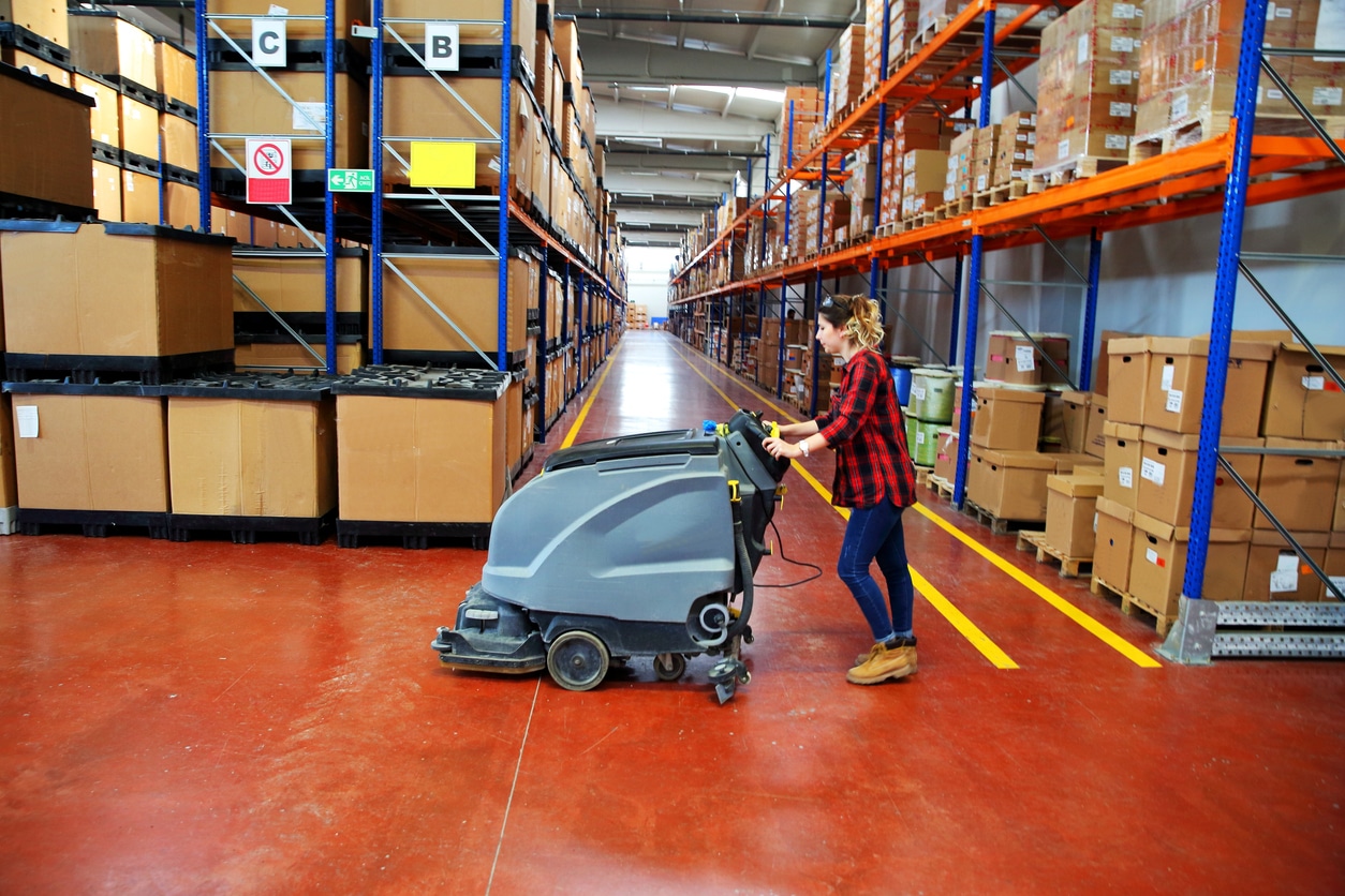 woman doing cleaning in warehouse